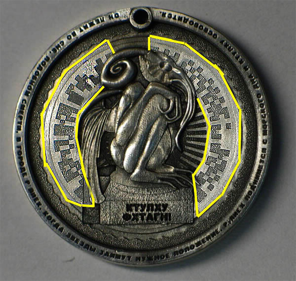 Silver coin with a squatting cthulhu on it, strange runes highlighted.